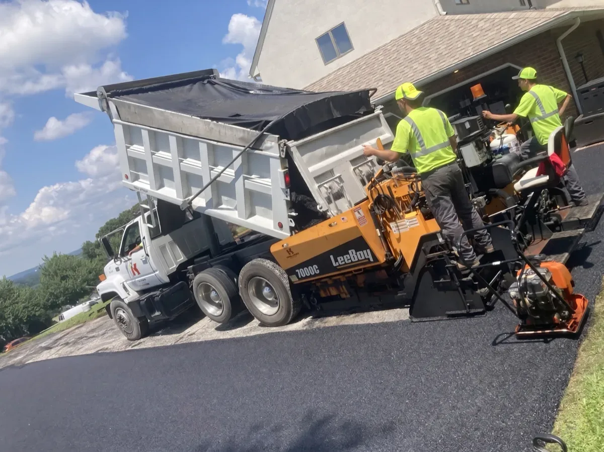 KJA crew paving a residential driveway with LeeBoy paving machine